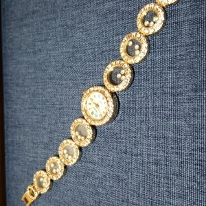 POV Bracelet Watch in Gold with clear crystals.